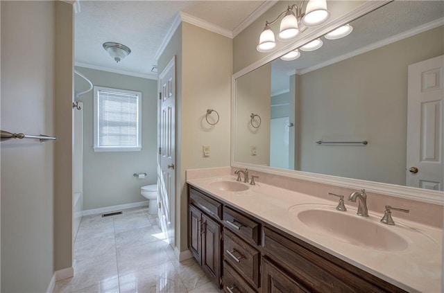 full bathroom featuring crown molding, a sink, toilet, and double vanity