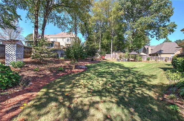 view of yard with a fenced backyard and a gazebo