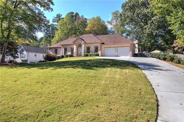 single story home featuring a garage, driveway, and a front yard