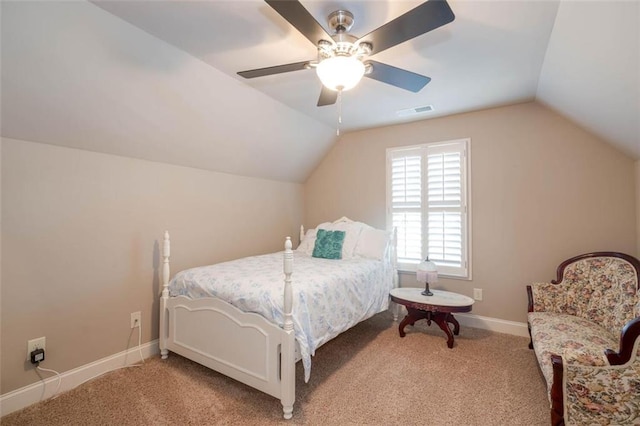 bedroom with ceiling fan, lofted ceiling, and light carpet