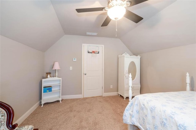 bedroom featuring light carpet, vaulted ceiling, and ceiling fan