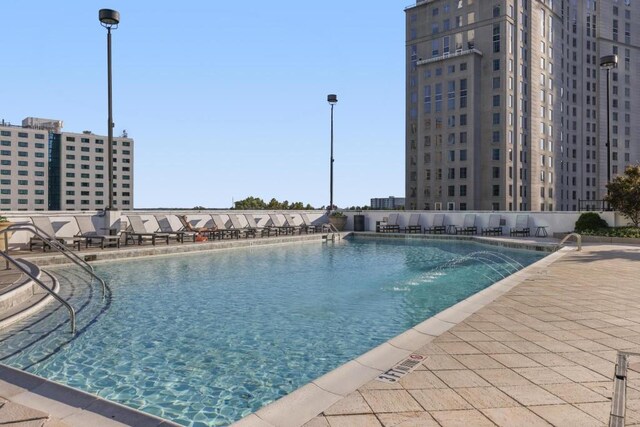 view of swimming pool featuring a patio