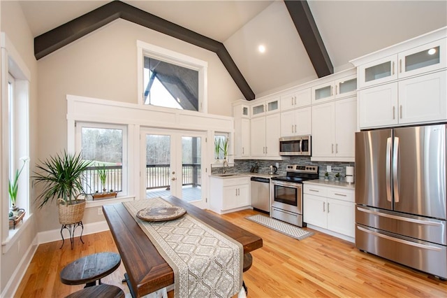 kitchen featuring french doors, white cabinets, and appliances with stainless steel finishes