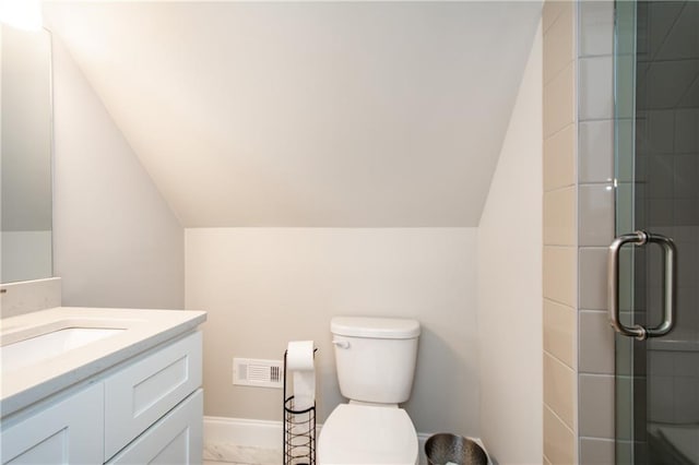 bathroom with lofted ceiling, vanity, toilet, and a shower with door