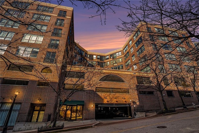 view of outdoor building at dusk