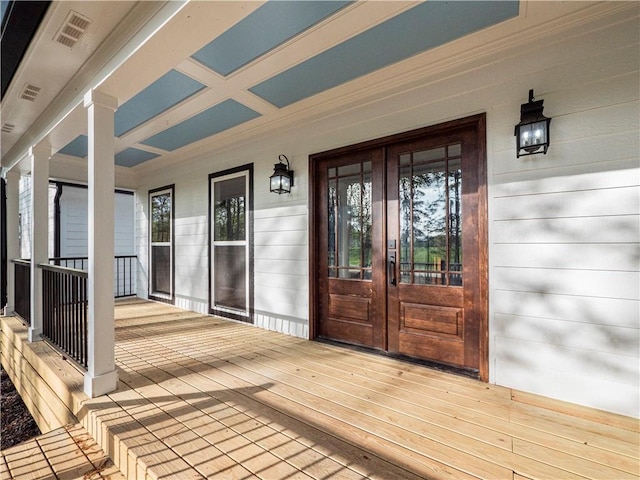 deck featuring french doors, visible vents, and a porch