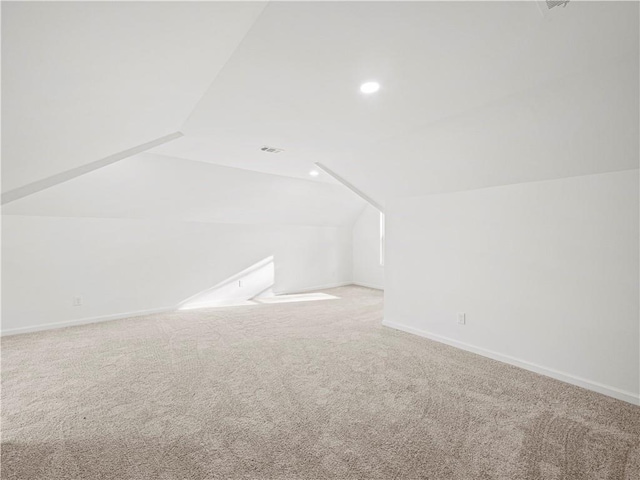 bonus room with recessed lighting, lofted ceiling, baseboards, and carpet floors