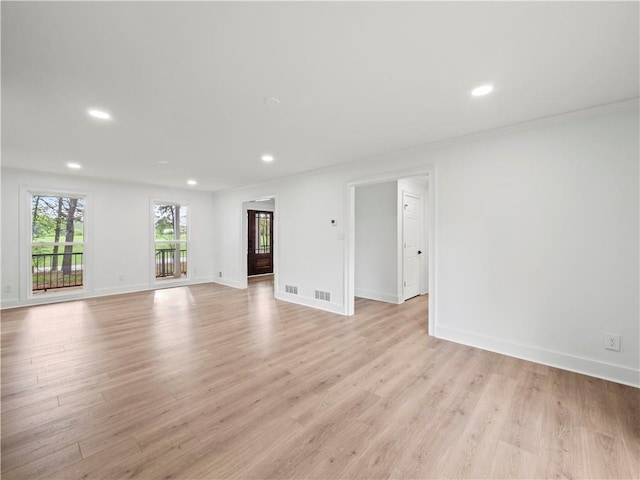 unfurnished room with baseboards, recessed lighting, and light wood-style floors