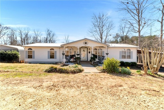 view of front facade featuring a porch and crawl space