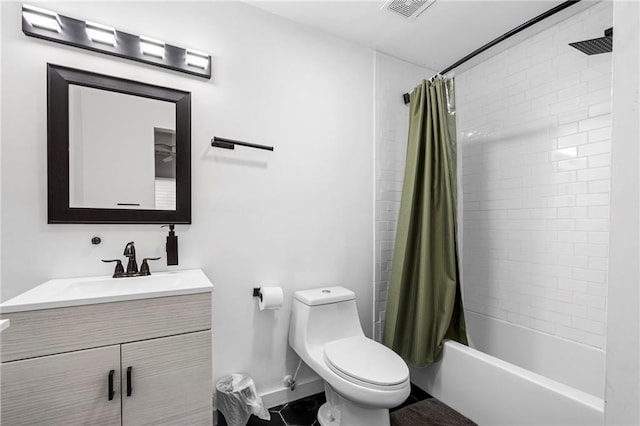 bathroom featuring shower / tub combo, vanity, baseboards, toilet, and visible vents