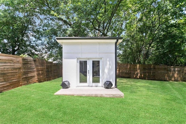 view of outbuilding featuring a fenced backyard and an outdoor structure