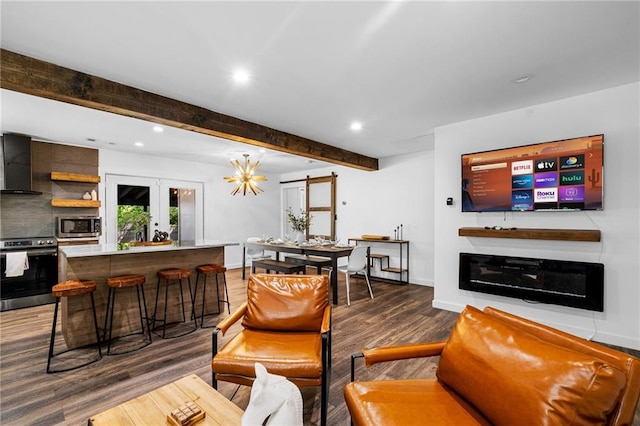 living area featuring beam ceiling, baseboards, recessed lighting, and wood finished floors