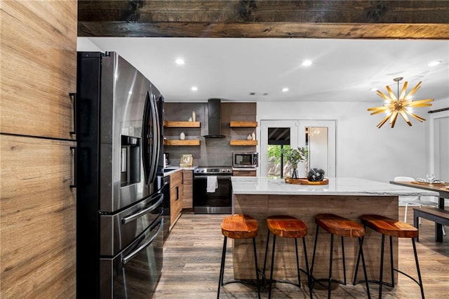 kitchen with appliances with stainless steel finishes, wood finished floors, open shelves, and modern cabinets