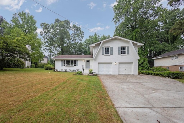 split level home featuring a garage, a gambrel roof, driveway, and a front yard