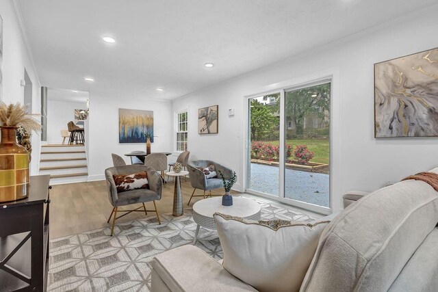 living area with wood finished floors and recessed lighting