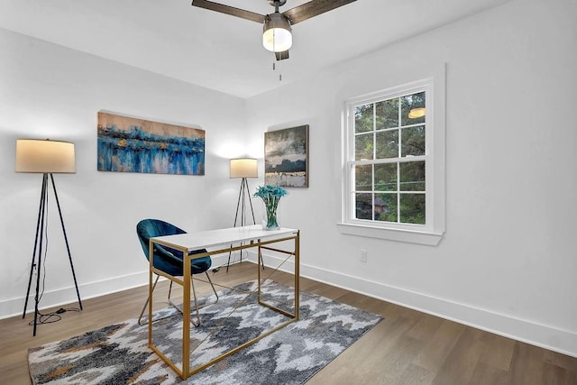 office area featuring wood finished floors, a ceiling fan, and baseboards