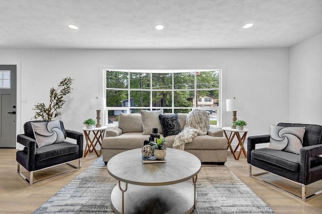 living room with recessed lighting and a healthy amount of sunlight