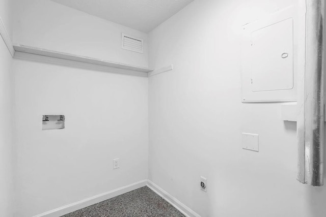laundry room featuring laundry area, washer hookup, electric panel, baseboards, and visible vents