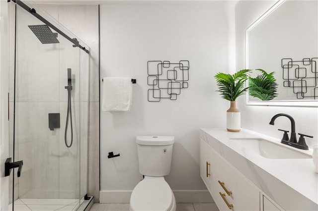 bathroom featuring vanity, a shower with shower door, and toilet