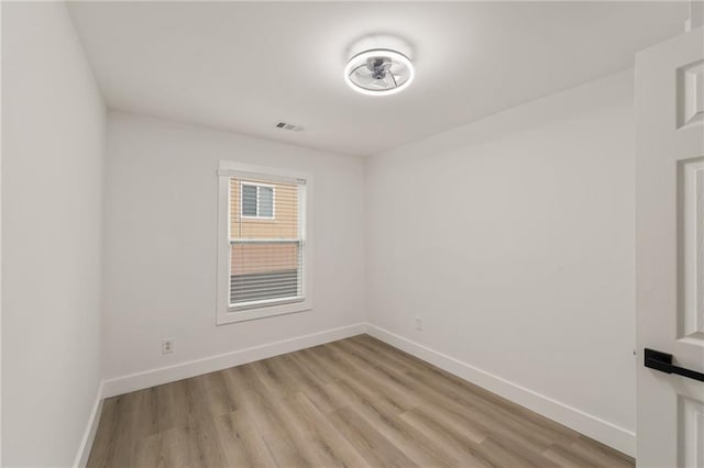 unfurnished room with light hardwood / wood-style floors