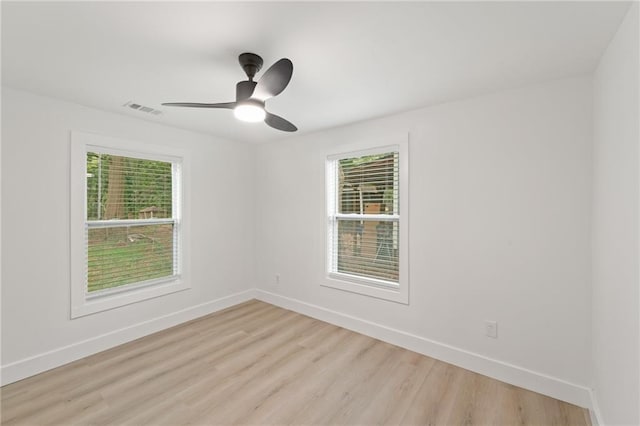 unfurnished room featuring ceiling fan and light hardwood / wood-style floors