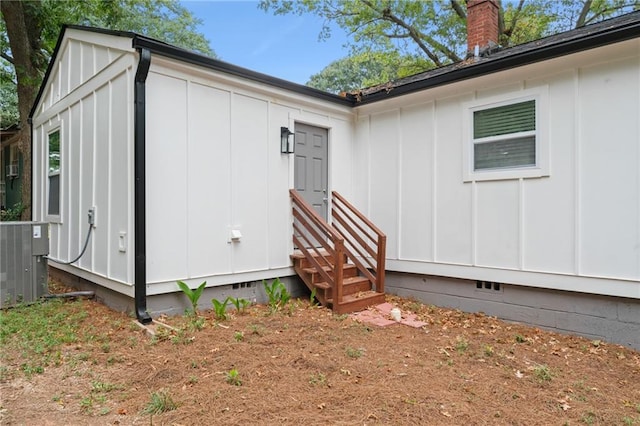 view of side of home featuring central AC unit