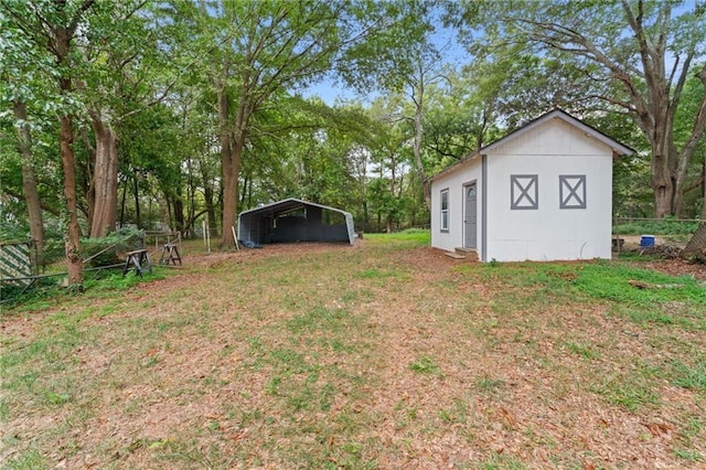 view of yard featuring a shed and a carport