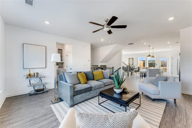 6121 Wayburn St, Tucker, GA 30084 - living area with light wood-style floors, ceiling fan, recessed lighting, and stairs