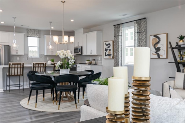 528 Aberdeen Mdw, Acworth, GA 30102 - dining room featuring an inviting chandelier, dark wood-style floors, and recessed lighting