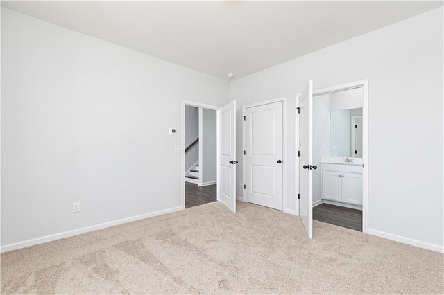 528 Aberdeen Mdw, Acworth, GA 30102 - unfurnished bedroom featuring baseboards, carpet, a sink, and connected bathroom