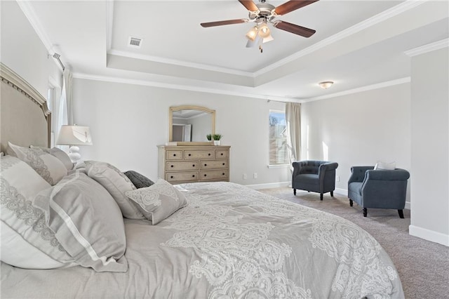 bedroom featuring a raised ceiling, visible vents, crown molding, and light carpet