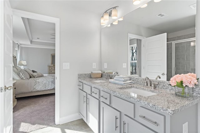 ensuite bathroom featuring ensuite bath, a sink, visible vents, and a shower stall