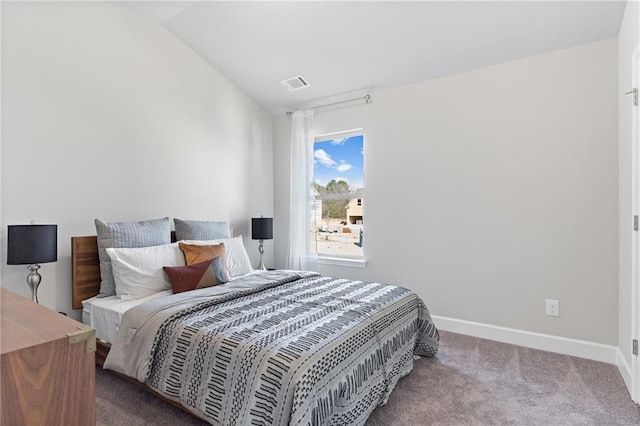 bedroom with lofted ceiling, carpet, visible vents, and baseboards