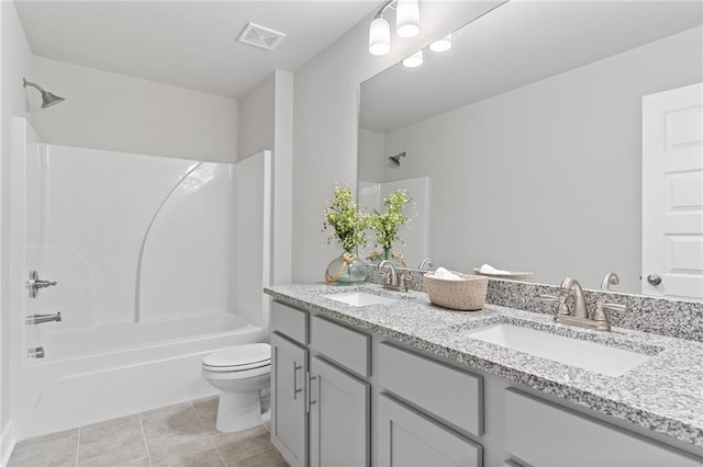 full bath with toilet, double vanity, washtub / shower combination, and a sink