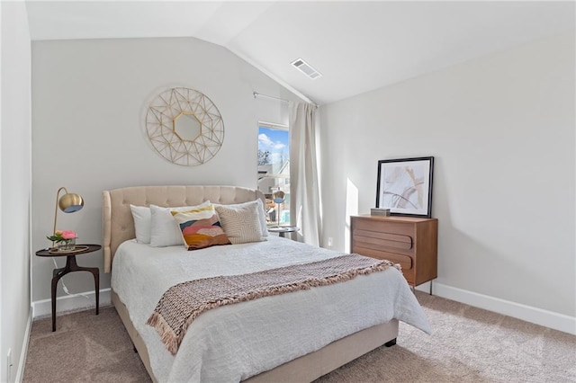 bedroom featuring visible vents, vaulted ceiling, light carpet, and baseboards