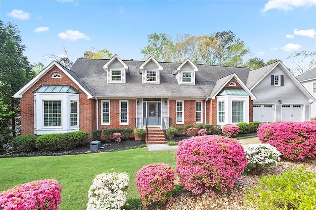 4086 Norton Pl SE, Smyrna, GA 30082 - cape cod house featuring brick siding, a front yard, a garage, and roof with shingles
