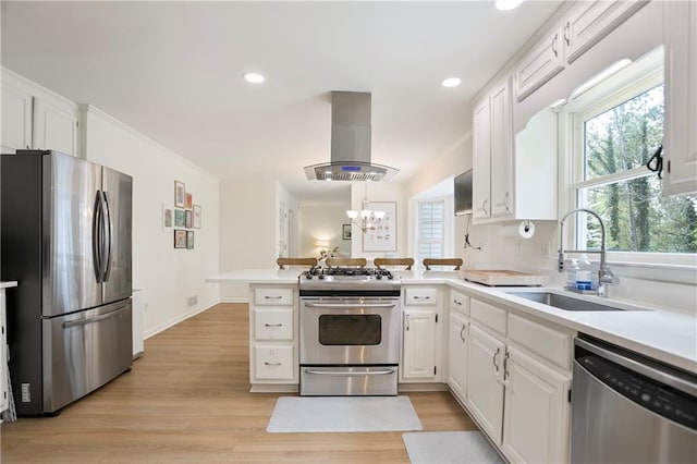 4086 Norton Pl SE, Smyrna, GA 30082 - kitchen featuring range hood, a peninsula, white cabinets, a sink, and stainless steel appliances