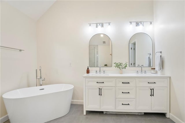 4086 Norton Pl SE, Smyrna, GA 30082 - full bath with a freestanding tub, double vanity, a sink, and tile patterned flooring