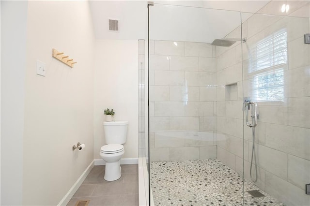 4086 Norton Pl SE, Smyrna, GA 30082 - bathroom featuring tile patterned floors, visible vents, a stall shower, and toilet