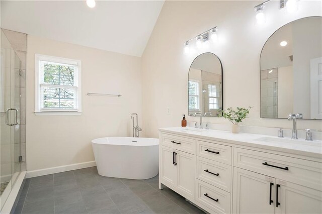 4086 Norton Pl SE, Smyrna, GA 30082 - full bathroom featuring a sink, double vanity, a stall shower, and vaulted ceiling
