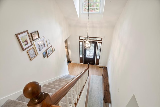 4086 Norton Pl SE, Smyrna, GA 30082 - foyer with stairs, a notable chandelier, baseboards, and wood finished floors