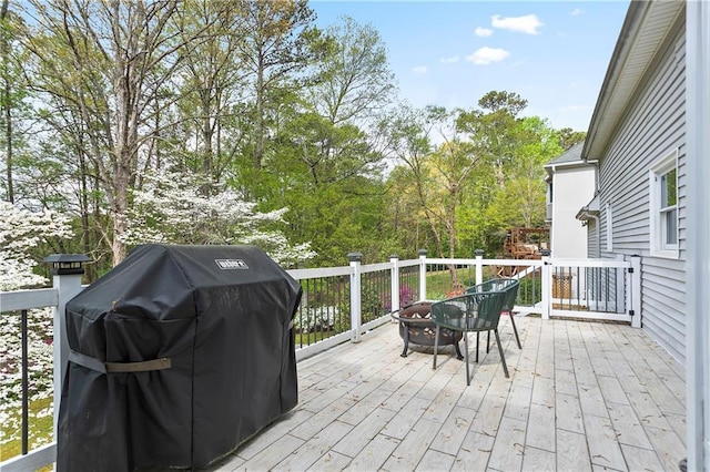 4086 Norton Pl SE, Smyrna, GA 30082 - view of patio with grilling area, an outdoor fire pit, and a deck