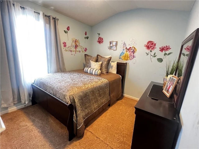 bedroom with carpet flooring and lofted ceiling