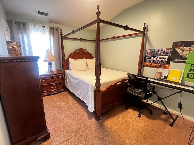 bedroom featuring carpet floors and vaulted ceiling