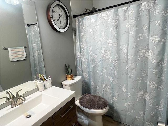 bathroom with vanity and toilet