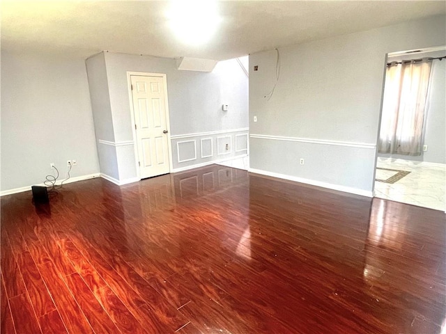 spare room with hardwood / wood-style floors