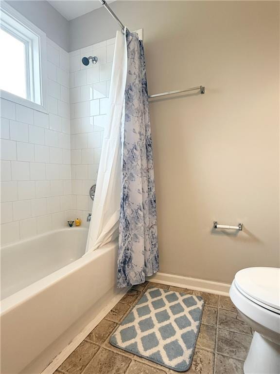 602 Summer Pl, Norcross, GA 30071 - full bathroom with toilet, shower / bath combo, and baseboards