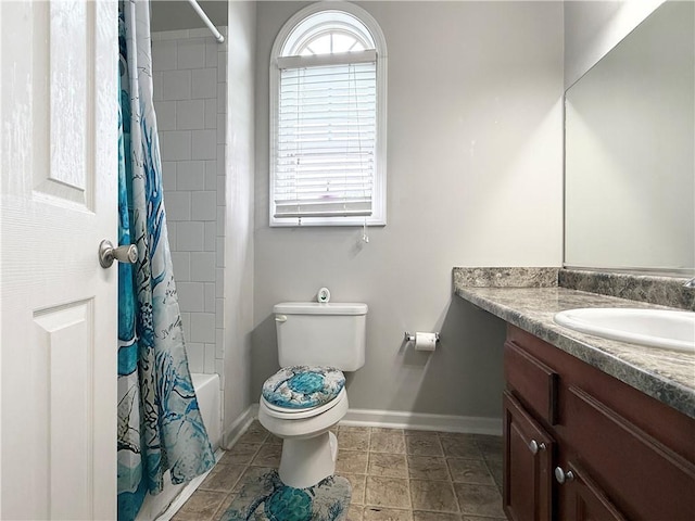 602 Summer Pl, Norcross, GA 30071 - bathroom with vanity, toilet, baseboards, and shower / tub combo