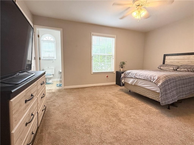 602 Summer Pl, Norcross, GA 30071 - carpeted bedroom featuring baseboards, ensuite bath, and ceiling fan