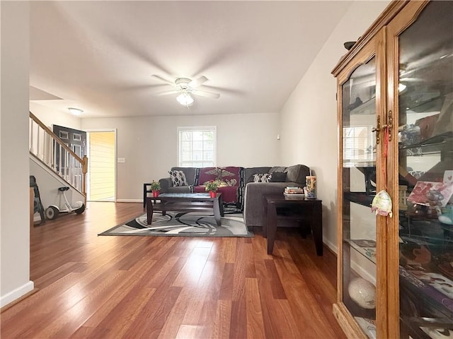 602 Summer Pl, Norcross, GA 30071 - living room featuring stairs, wood finished floors, a ceiling fan, and baseboards
